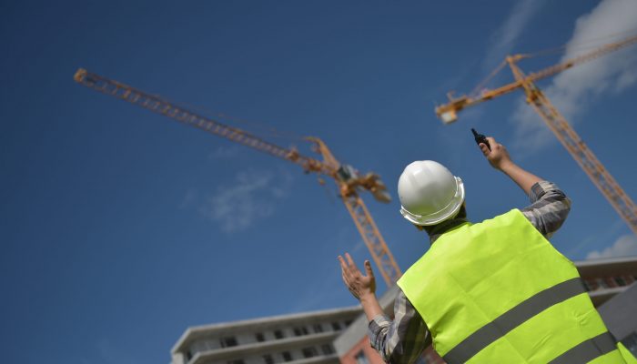 Foreman,Using,Walkie-talkie,On,Construction,Site,,France